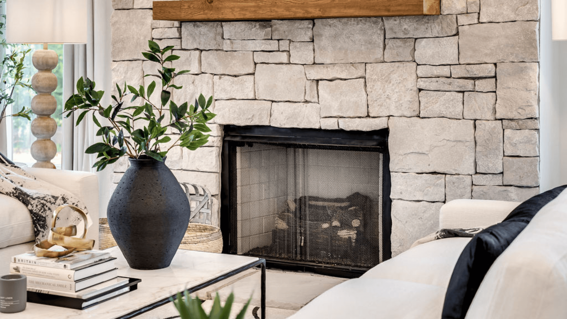 Stone designed fireplace in living area.