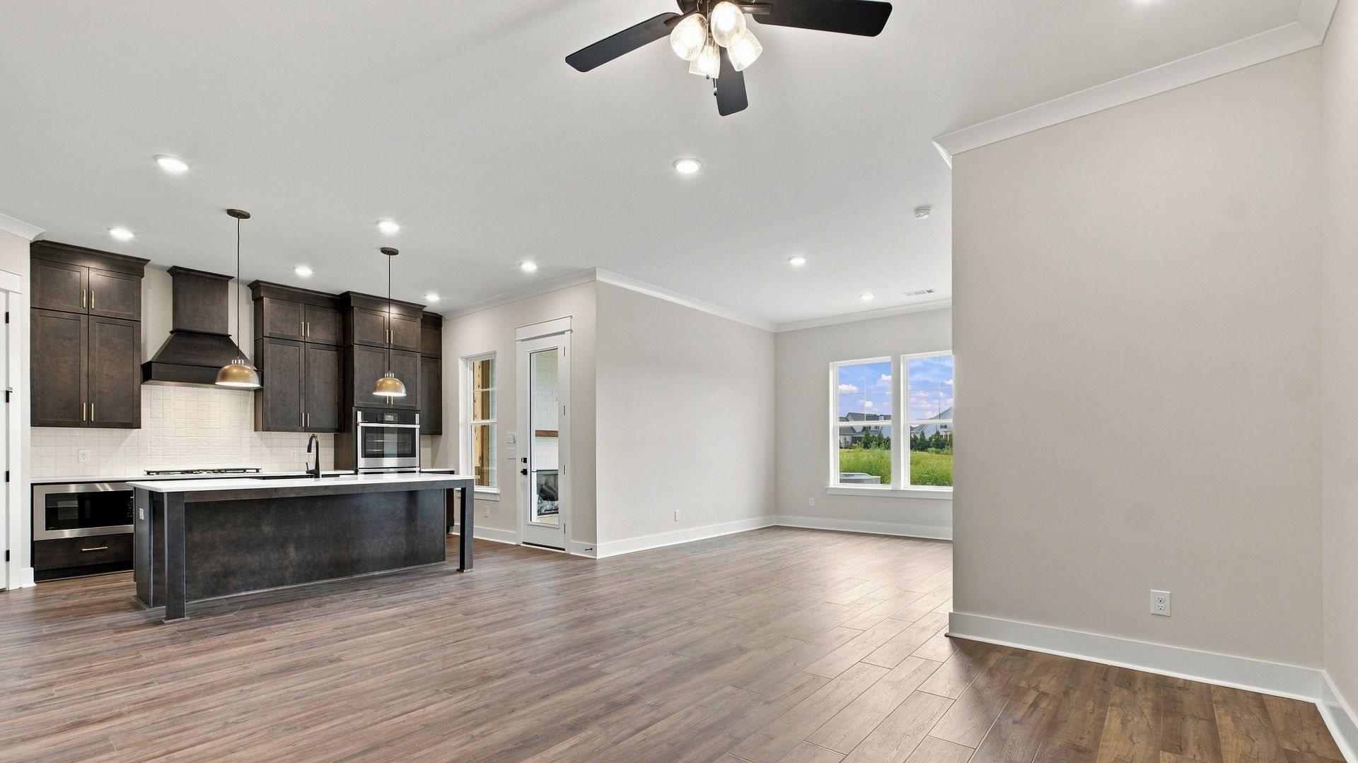 Dining space area next to kitchen with backyard view.