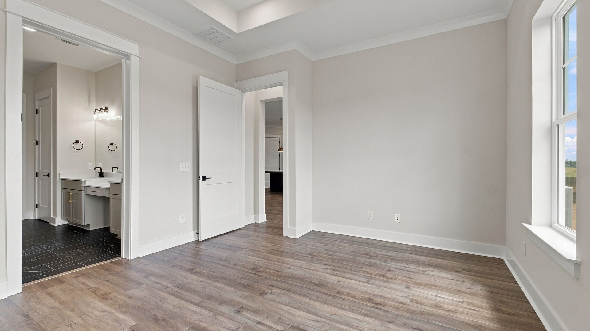 Entrance of connected bathroom and walk-in closet.
