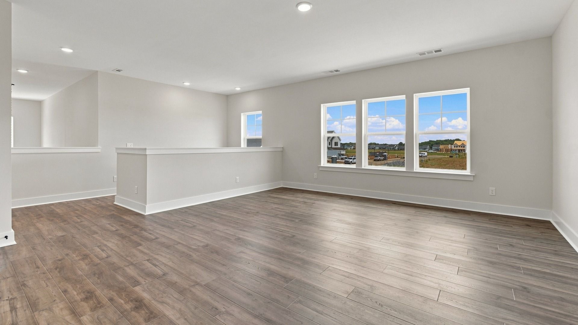 View from bedroom of stairway and of versatile living area.
