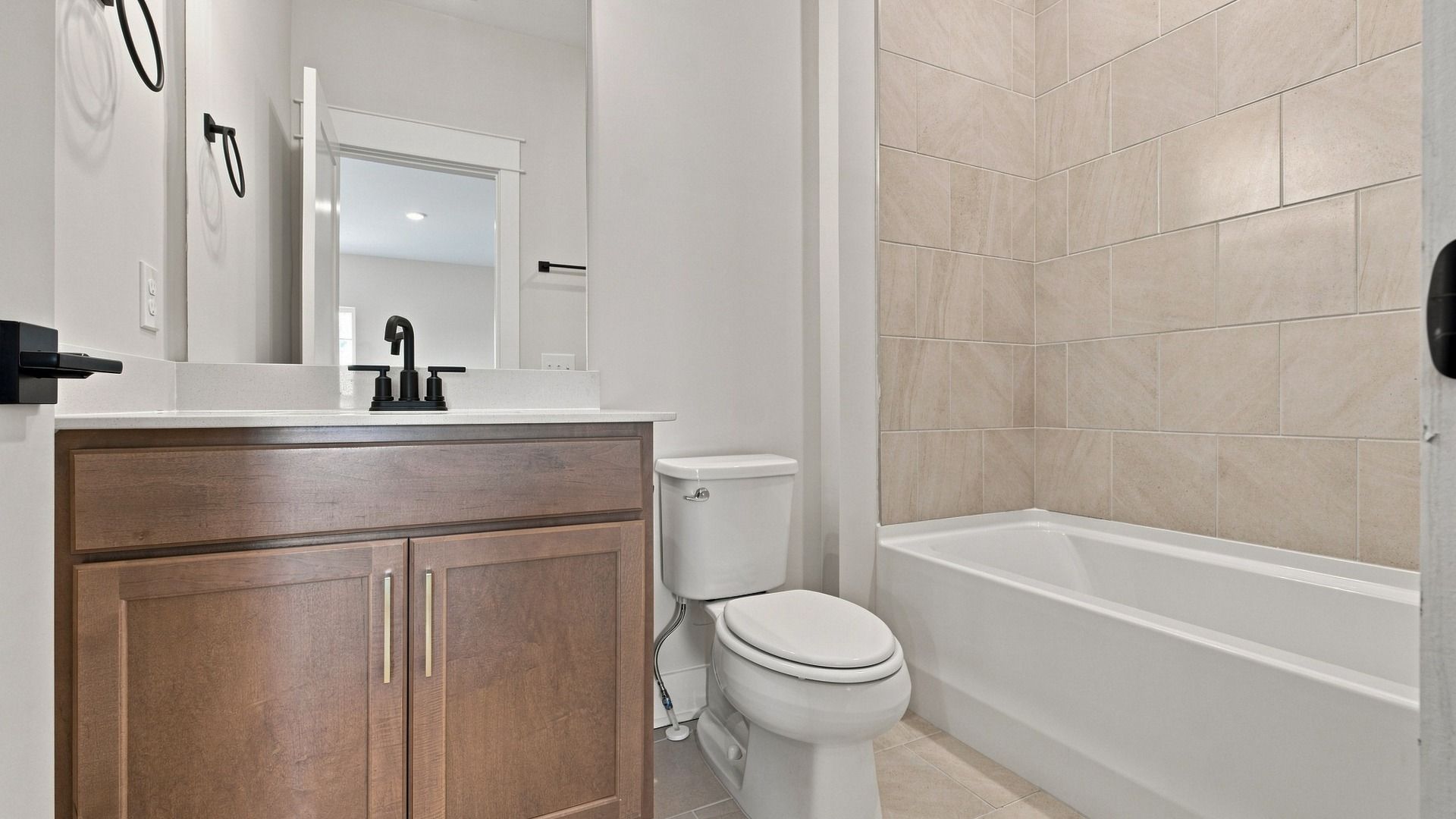 Classic bathroom with essentials as well as a bathtub.