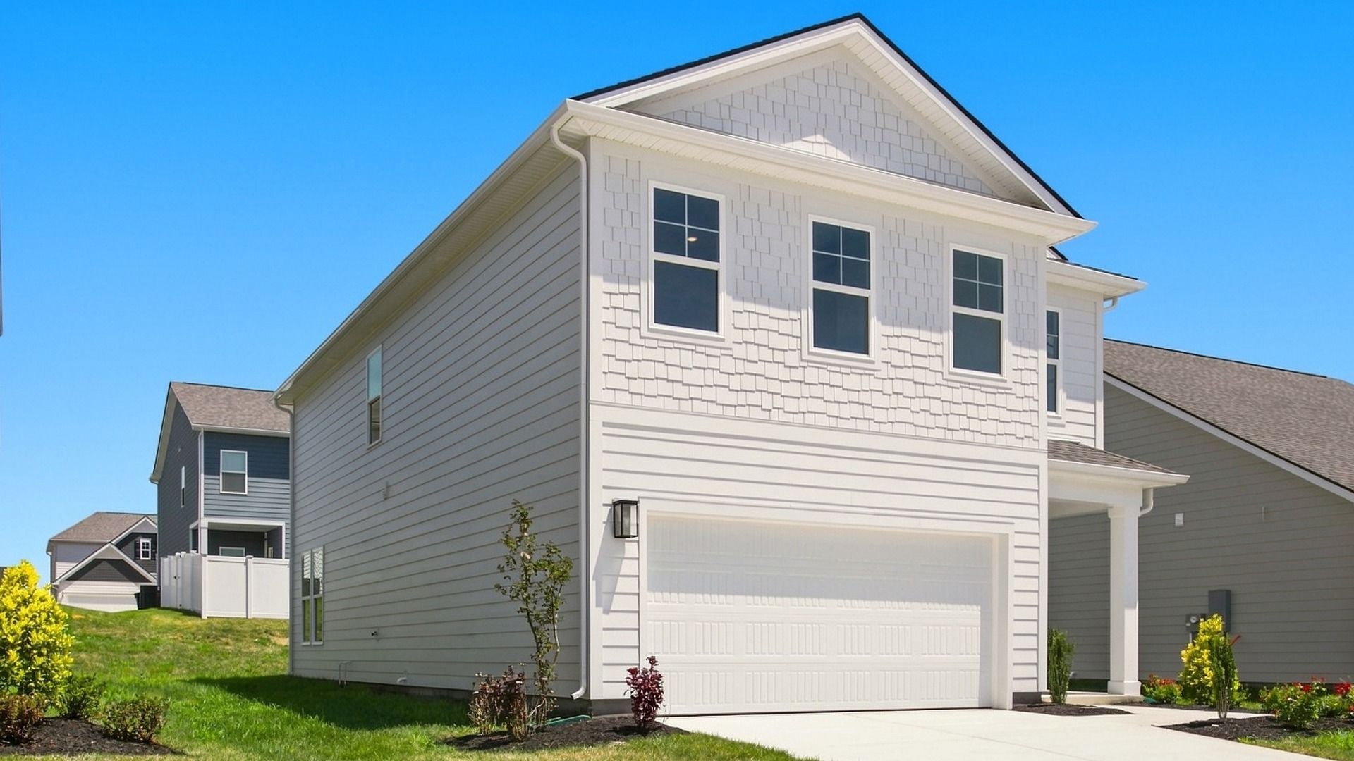 Angled view of home focused on garage side