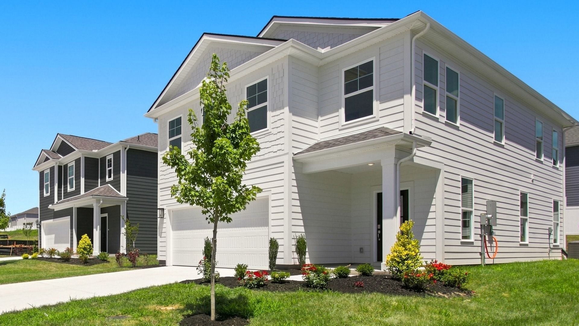 Angled view of two-story home focused on porch side
