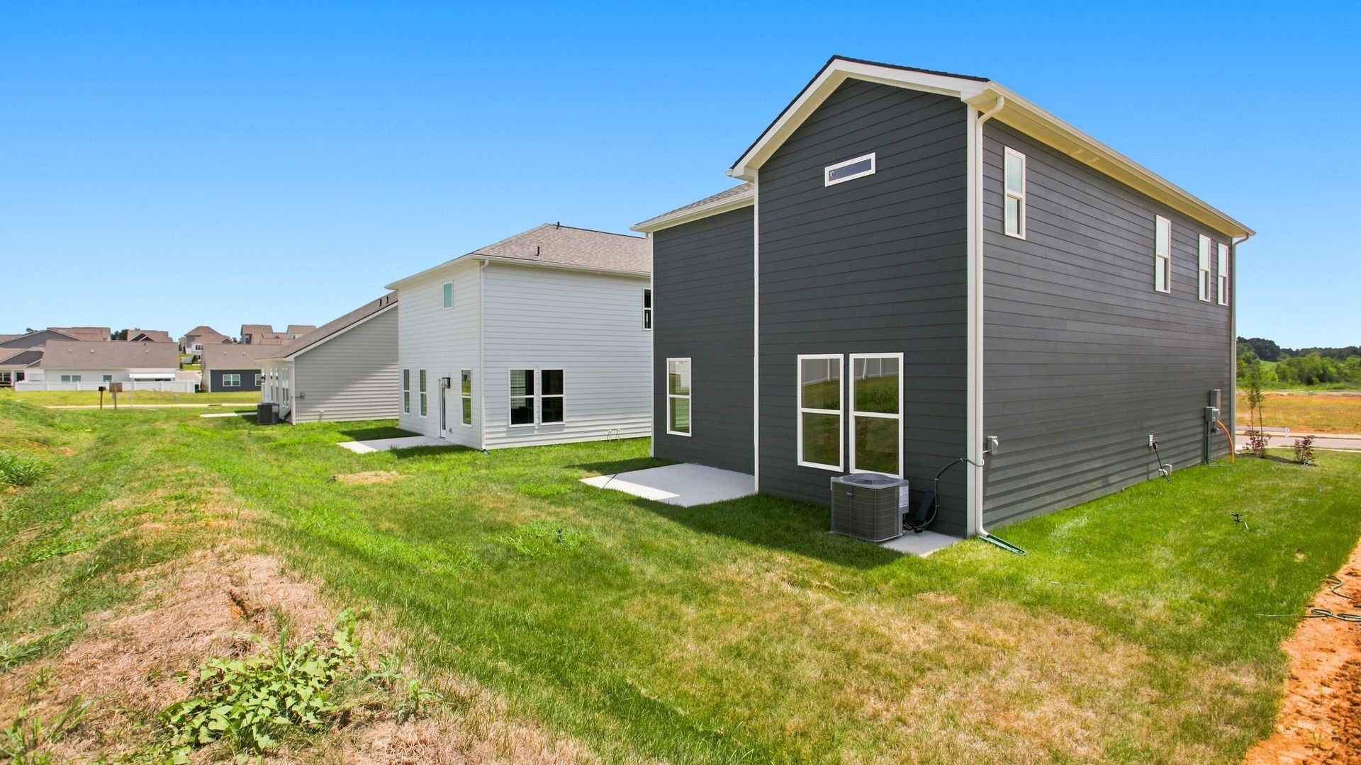 Angled shot of back home exterior from backyard