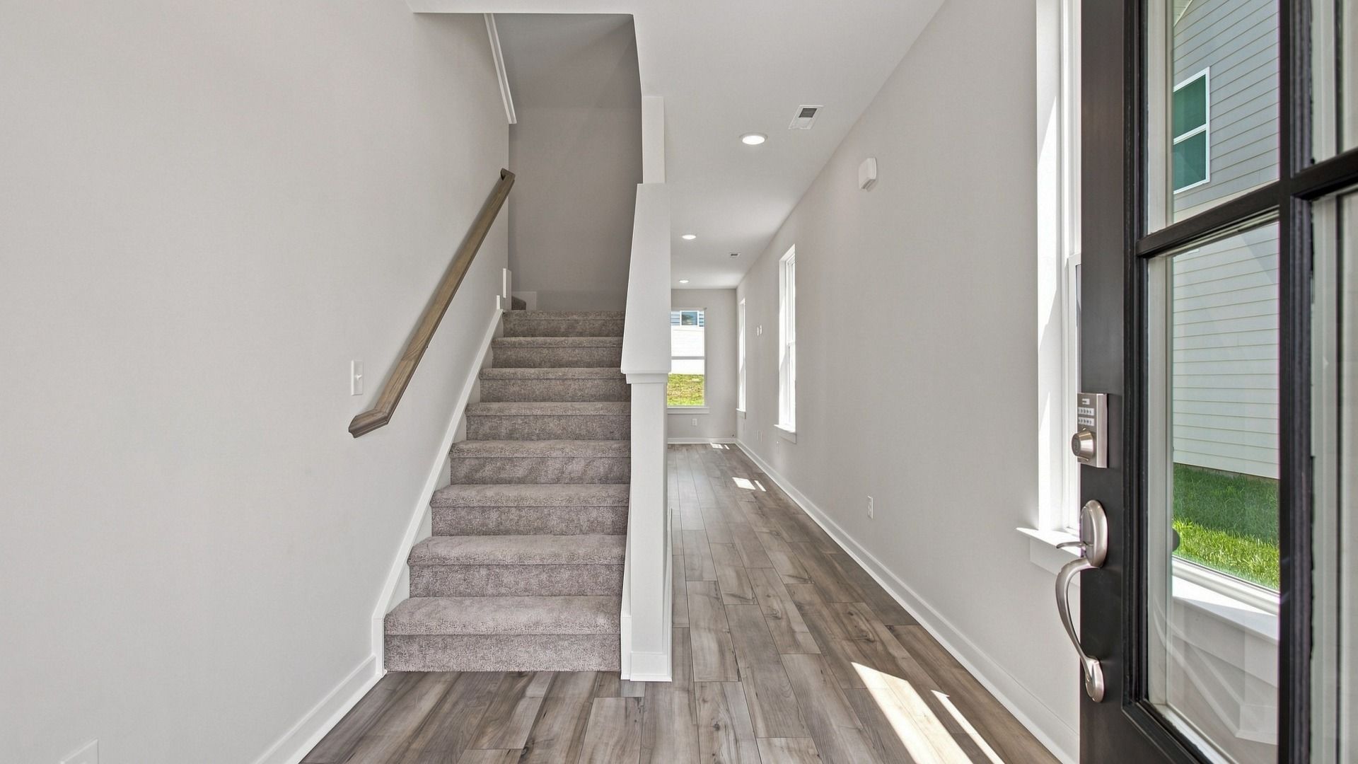 Immediate view of stairway and hallway from front door