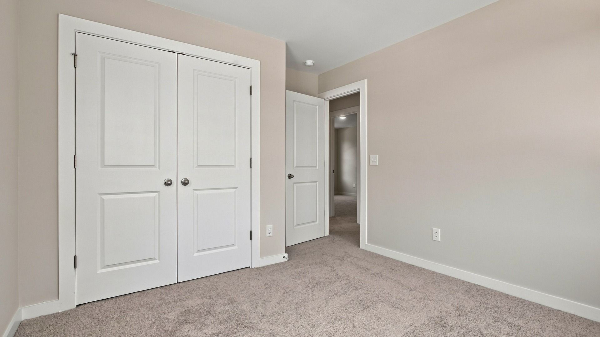 Secondary bedroom view from windows of closet and room entrance
