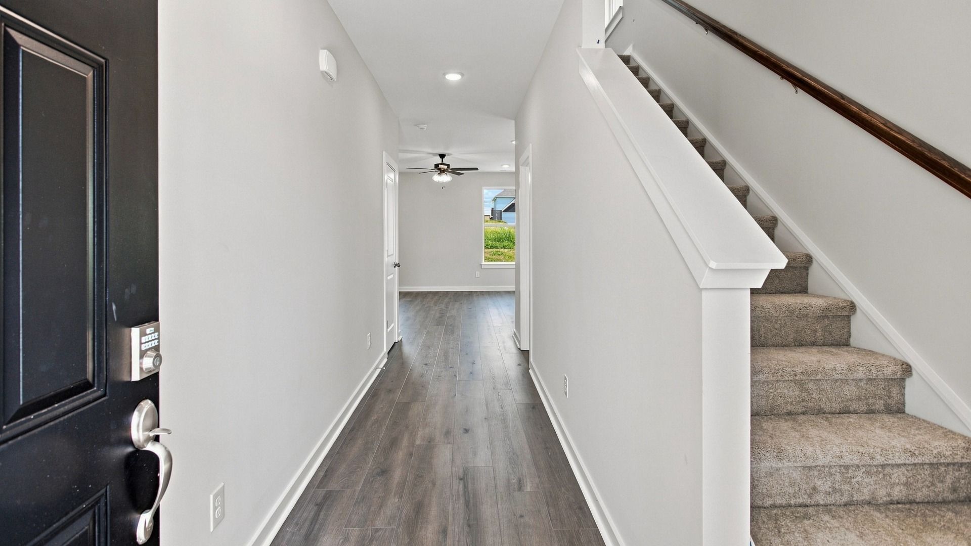 Immediate hallway and stairway entering into the home