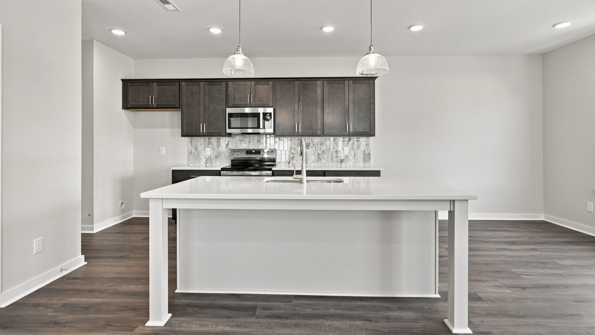 Kitchen with island and convenient cabinets with various dining areas