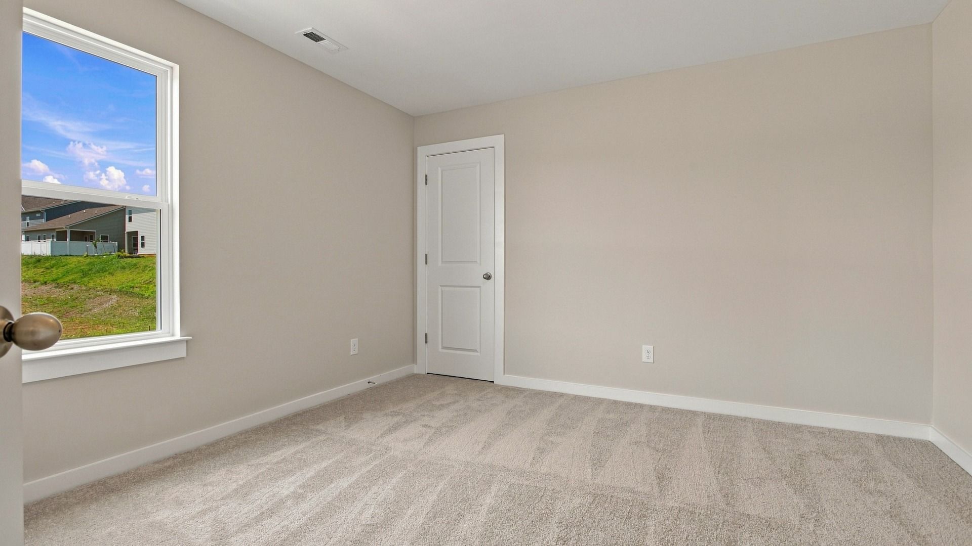Separate secondary room with window and closet