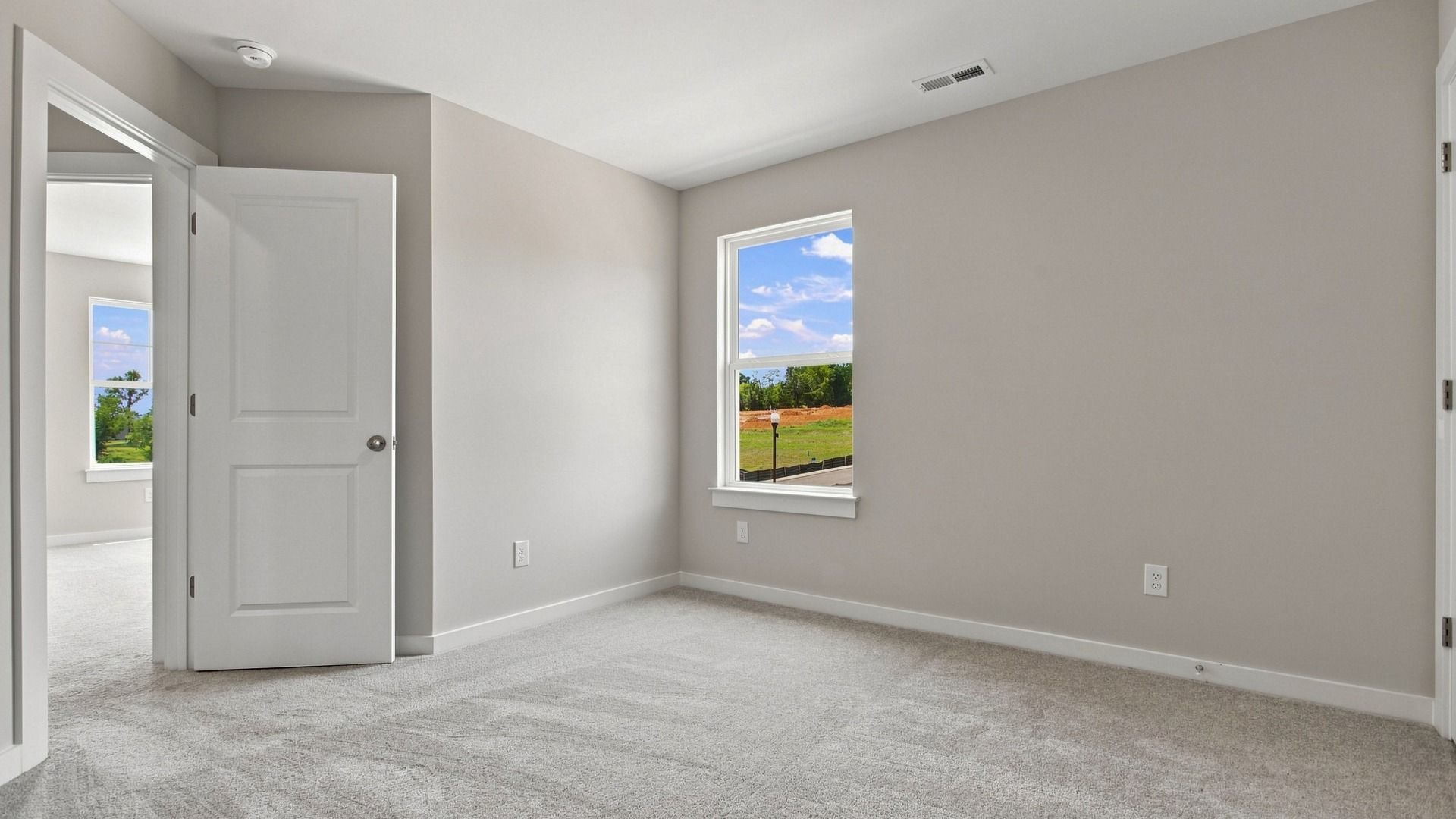 View of entrance to secondary bedroom with window