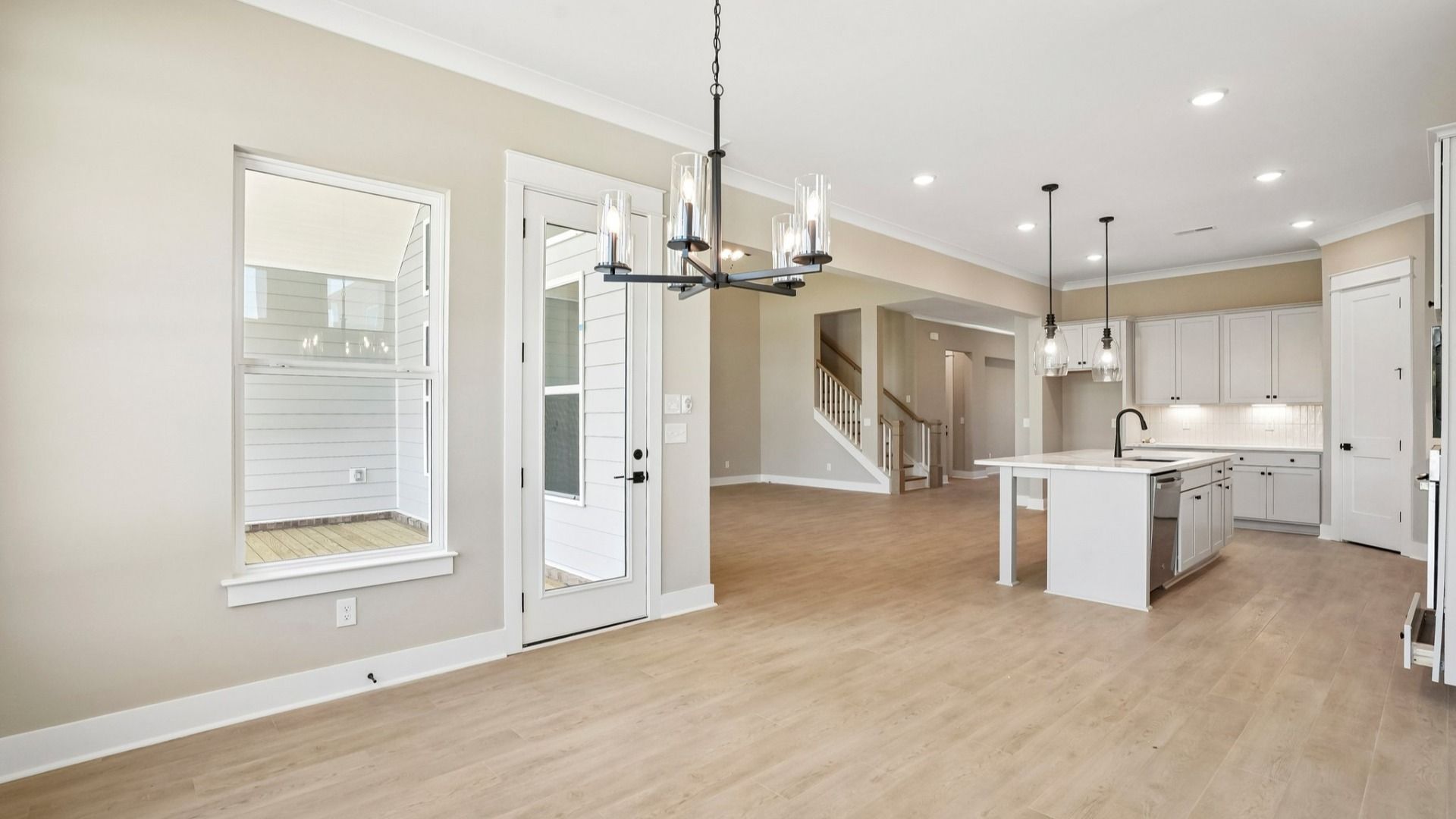 View of kitchen and living area from dining room