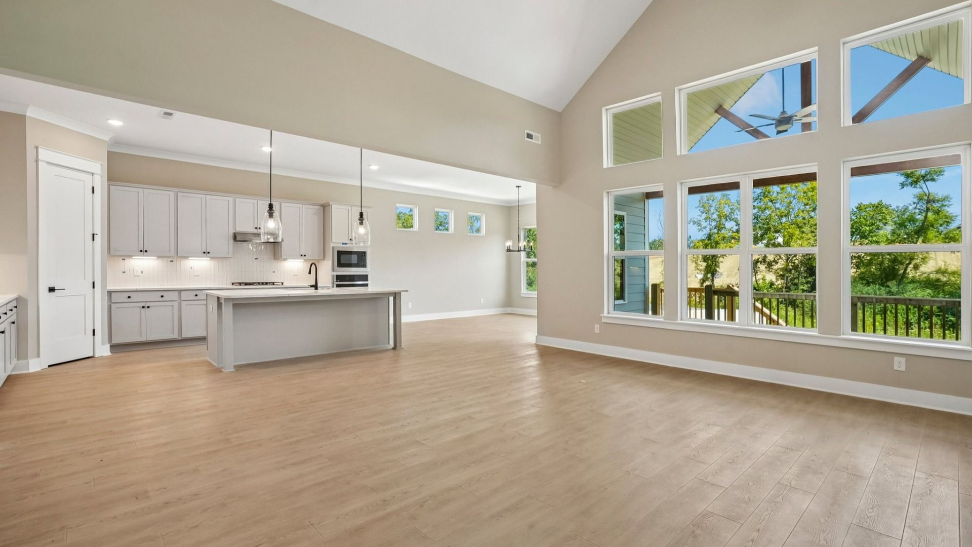 View from living room of elevated kitchen and dining spaces