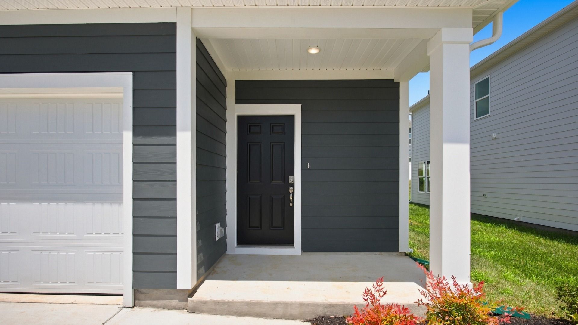 Covered front porch and front door to home