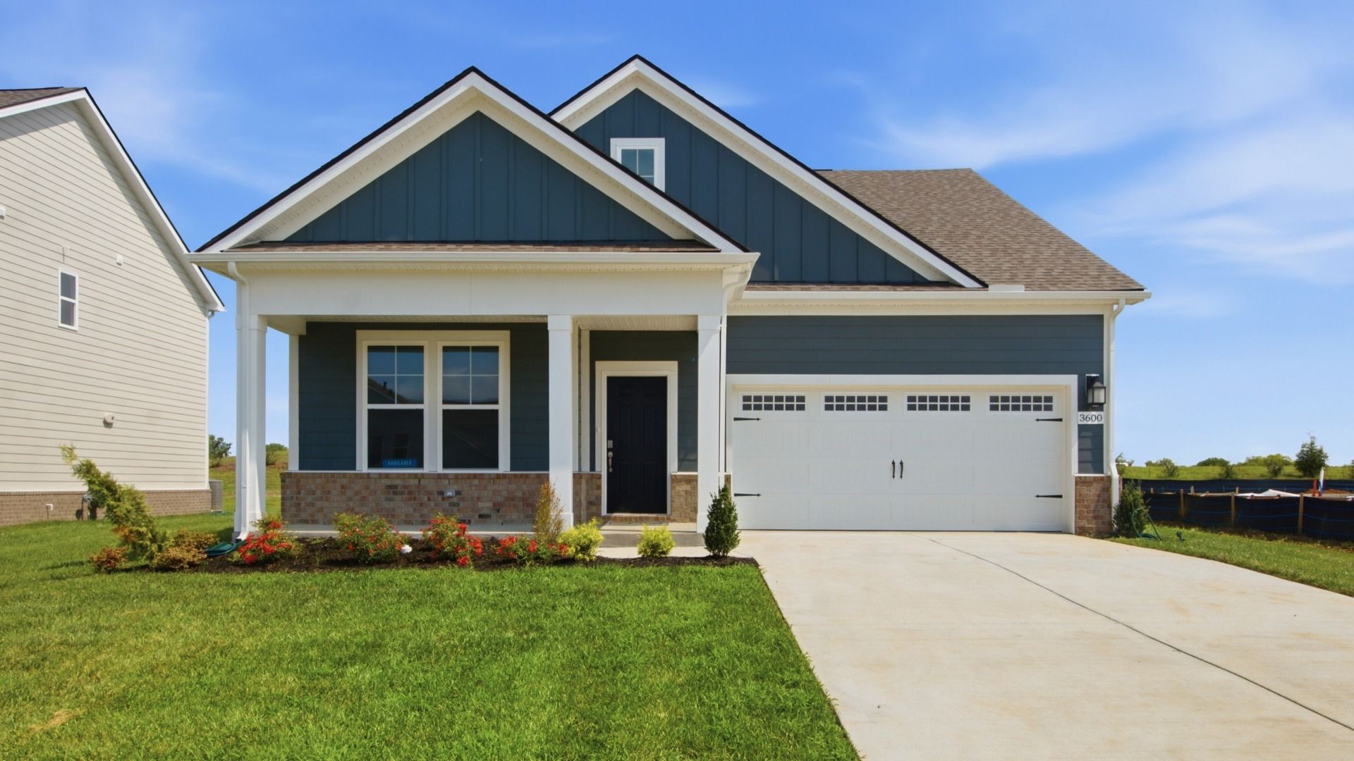 Two-story home in Colombia, TN featuring two car garage