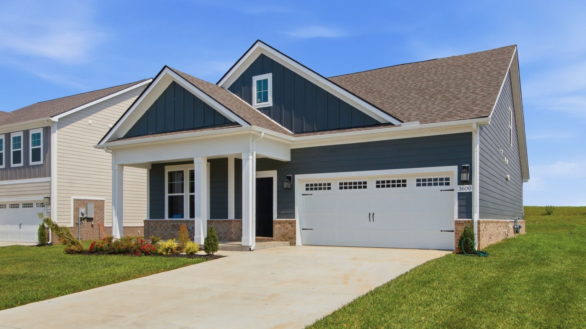 Angled image of home showing two car garage and driveway