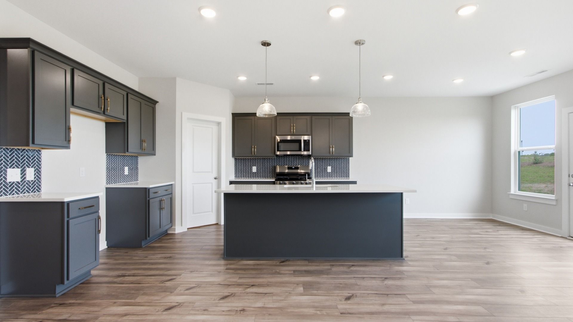 Convenient storage options for kitchen necessities with dark wash cabinets