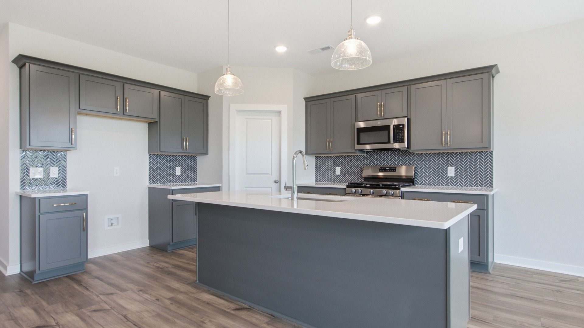 Closer view of kitchen essentials with detailed quartz backwash