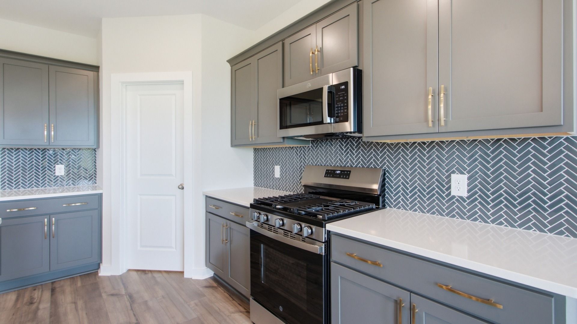 Convenient storage options with pantry door, open countertops, and various cabinet spacing