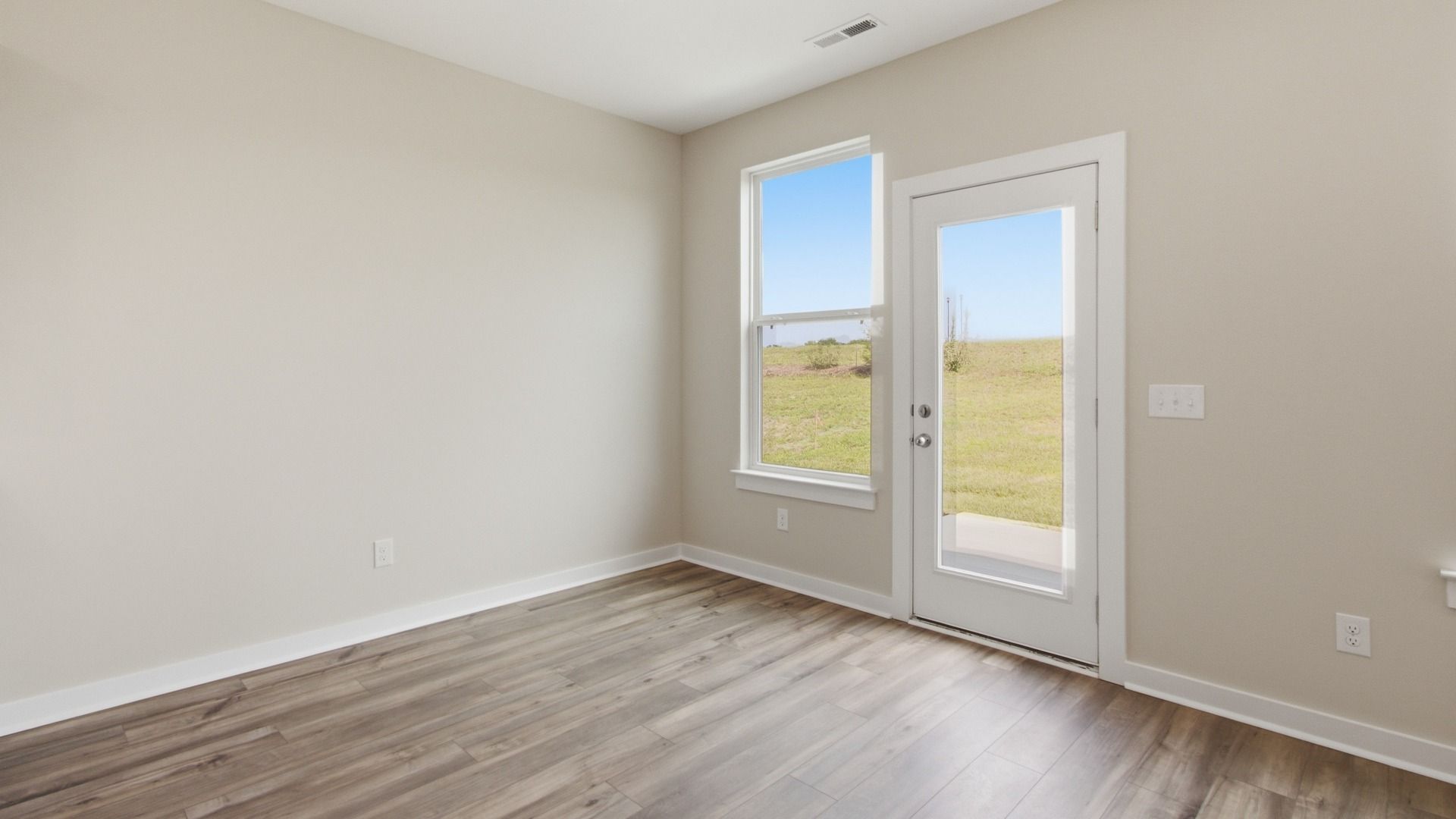 Backyard door next to kitchen/dining room
