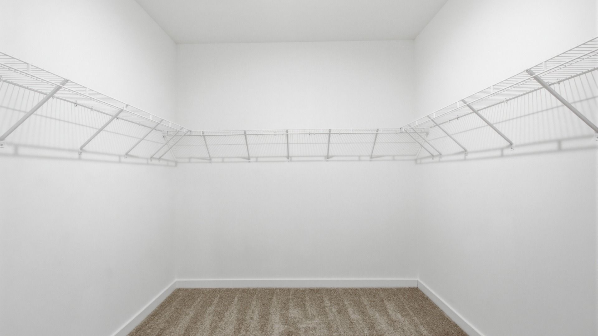 Sizeable walk-in closet with racks for storage options