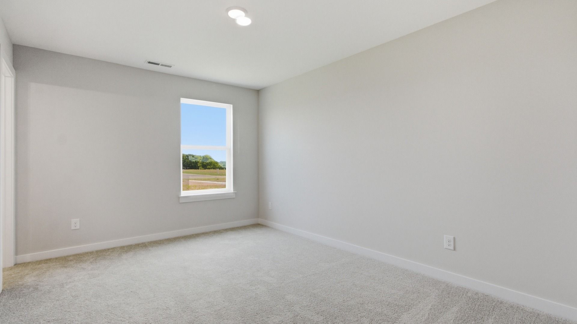 Upstairs secondary bedroom with window