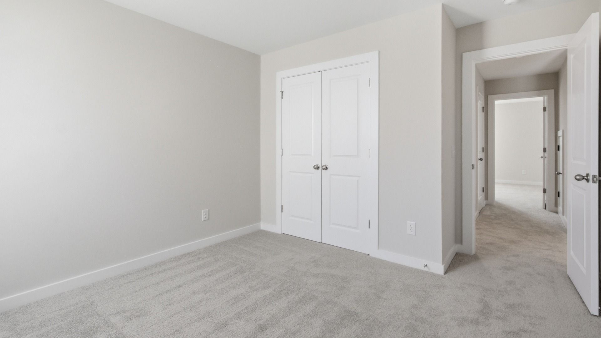 Spacious room with double-door closet next to room entrance