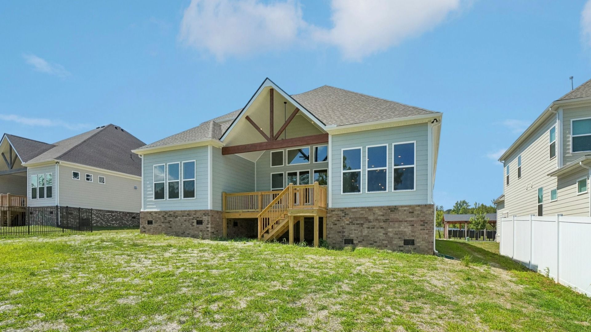 Rear exterior view of two-story home featuring back porch