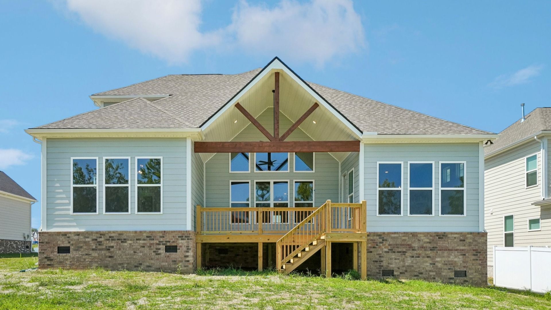 Rear exterior view of two-story home featuring back porch