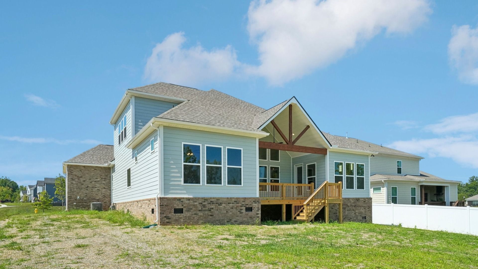 Rear exterior view of two-story home featuring back porch