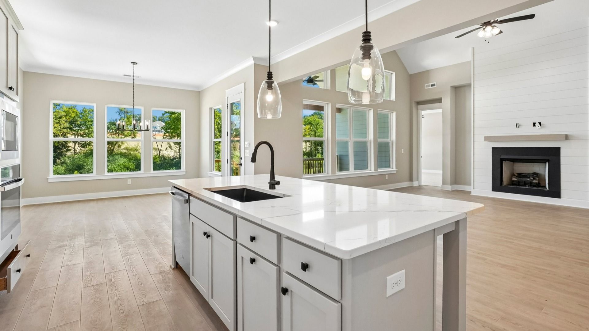 Kitchen with island paired with sink and dishwasher