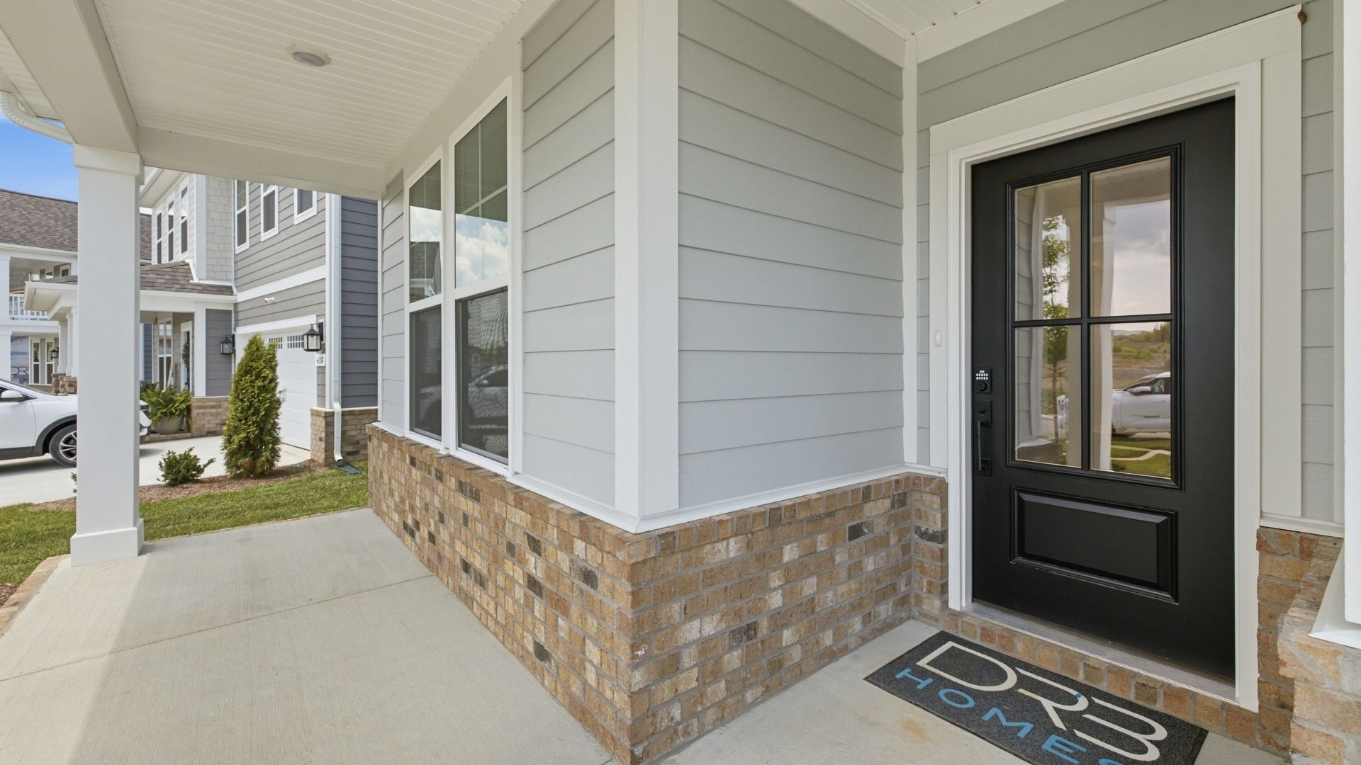 Covered front entry with front porch seating area