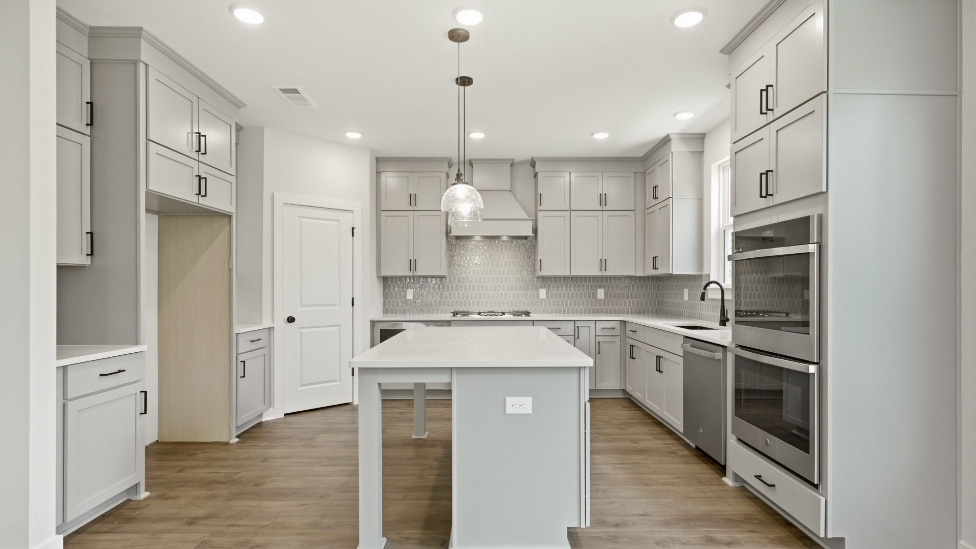 Ceiling height cabinet upgrade, quartz countertops, and ceramic tile backsplash