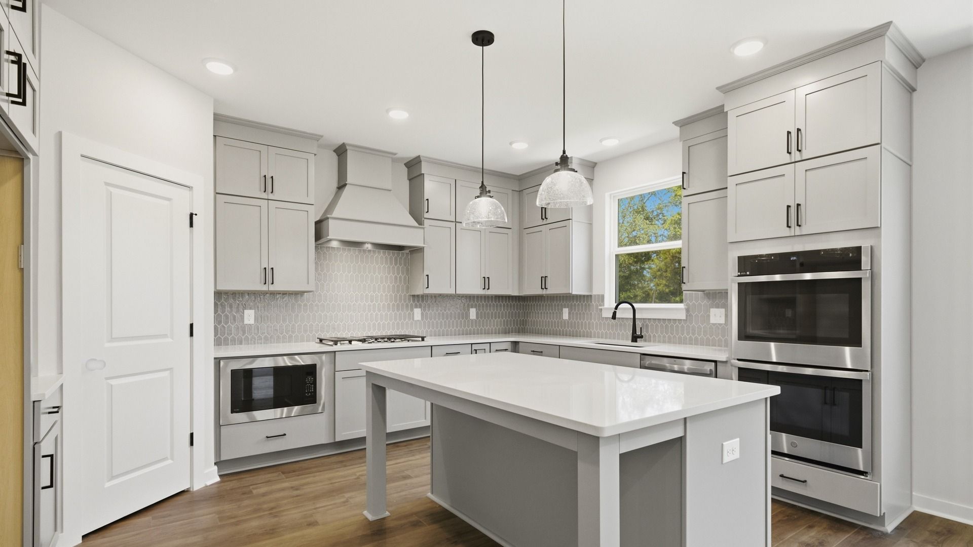 Ceiling height cabinet upgrade, quartz countertops, and ceramic tile backsplash