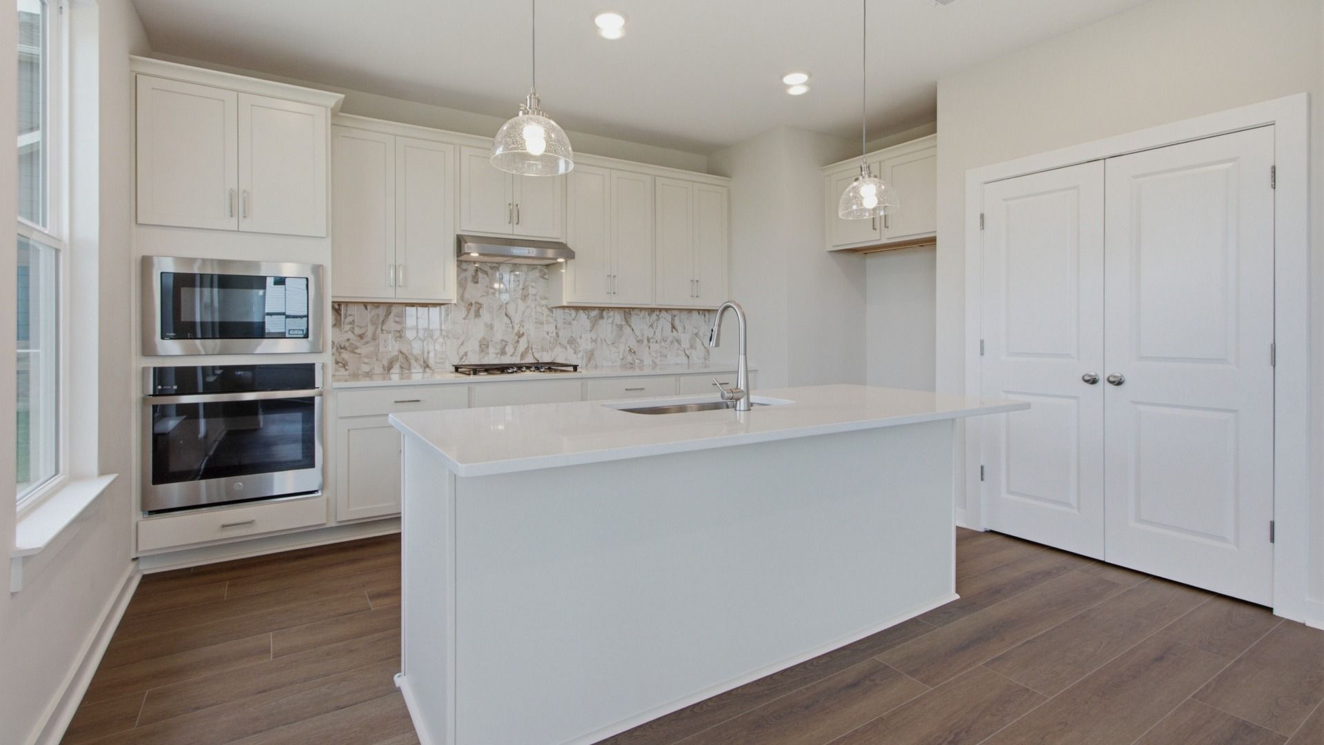 Kitchen essentials and elevated double-door pantry