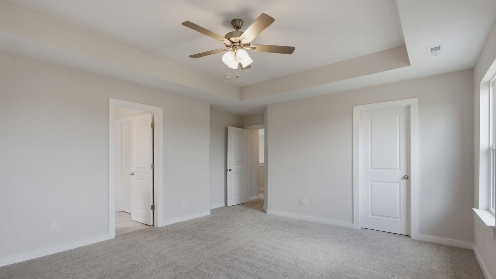 Connected bathroom and storage spacing in the primary bedroom