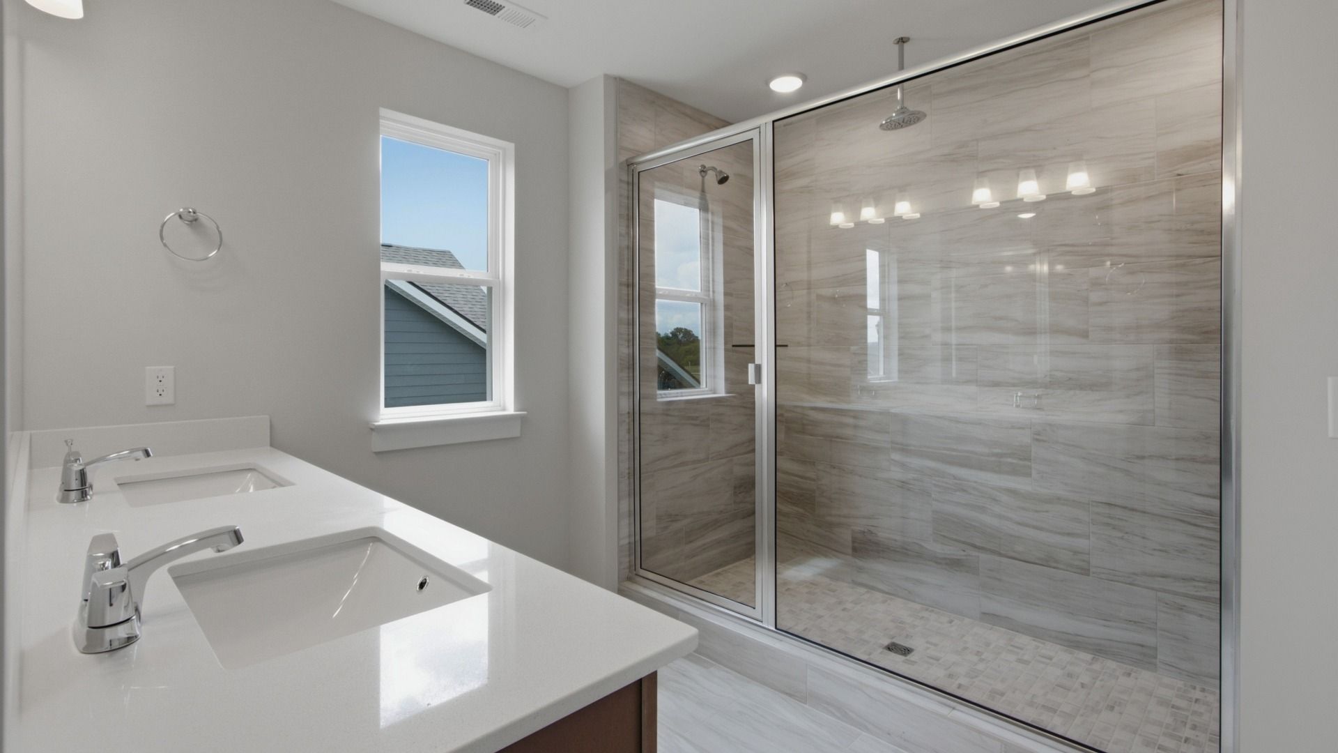 Elevated roman-shower across dual vanities