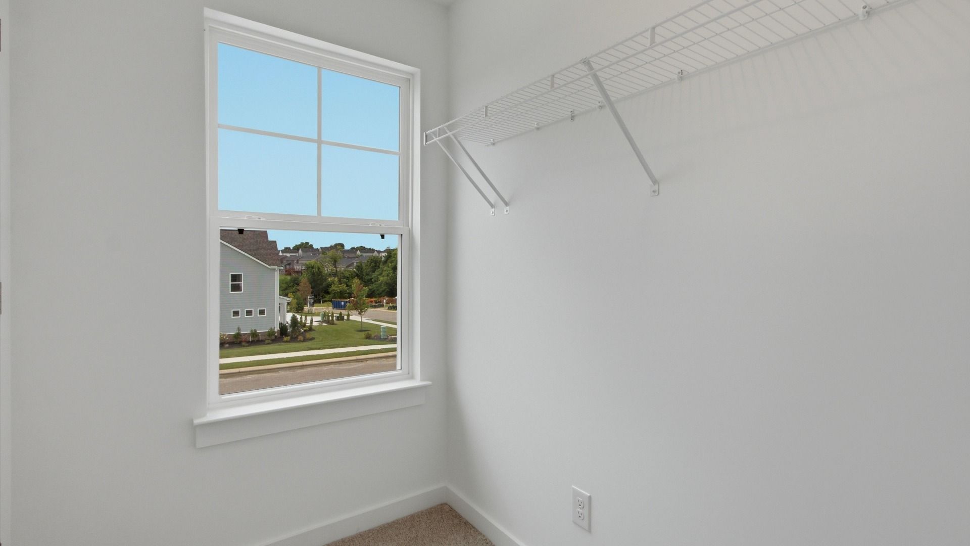 Closet with window and convenient storage spacing