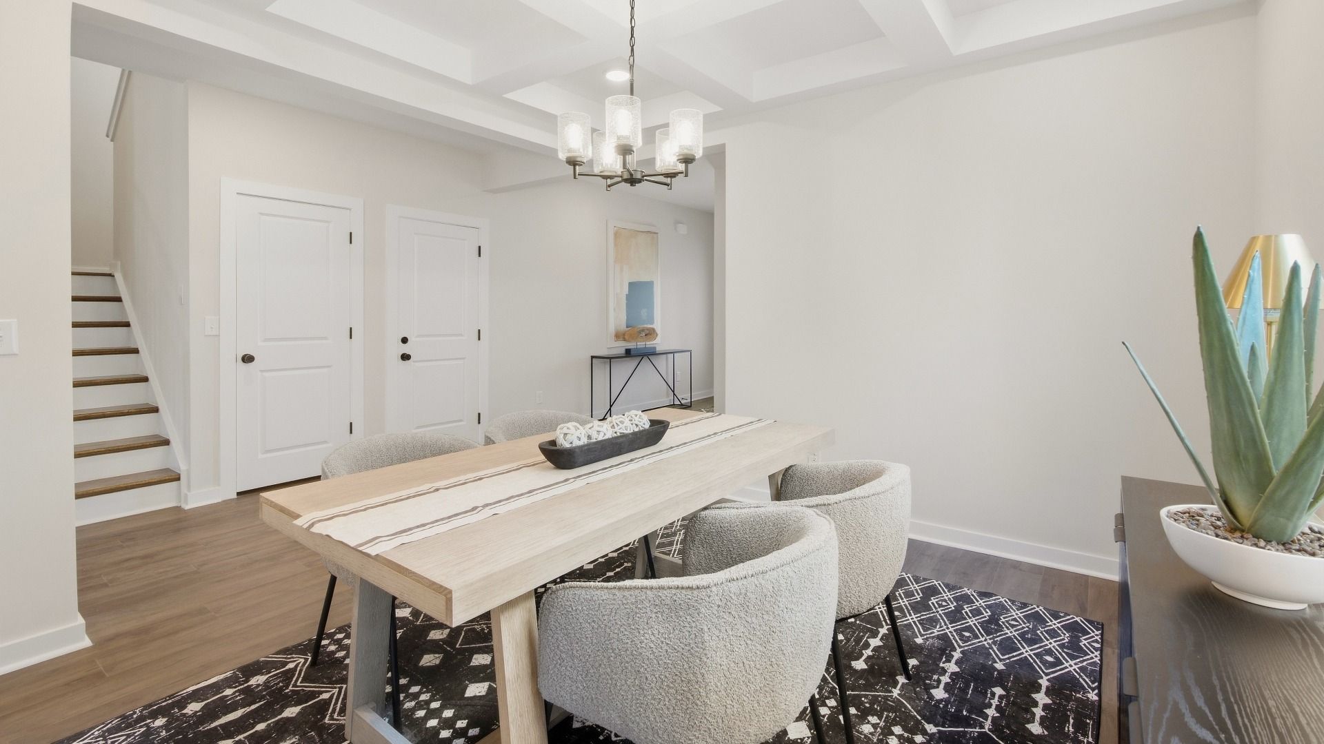 Versatile living space next to staircase