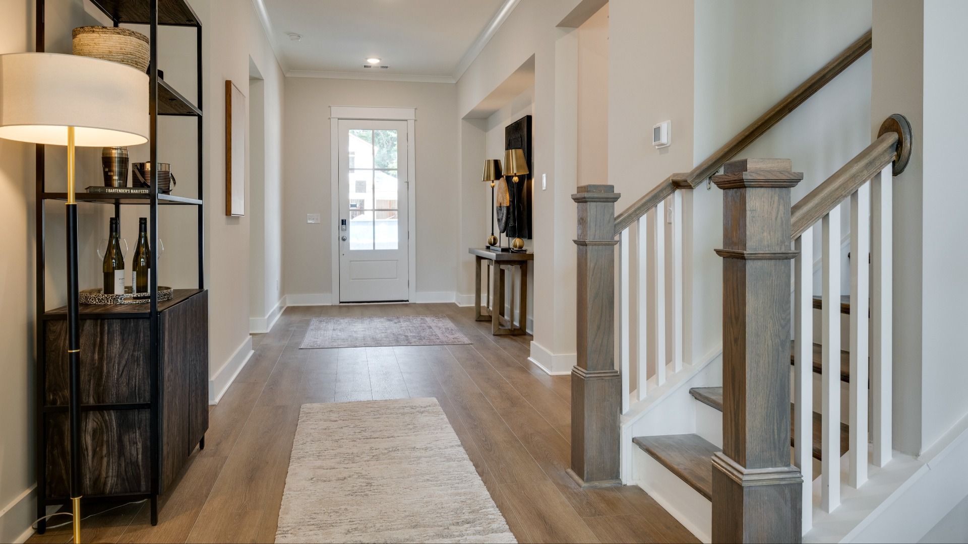 Living area next to hallway and staircase