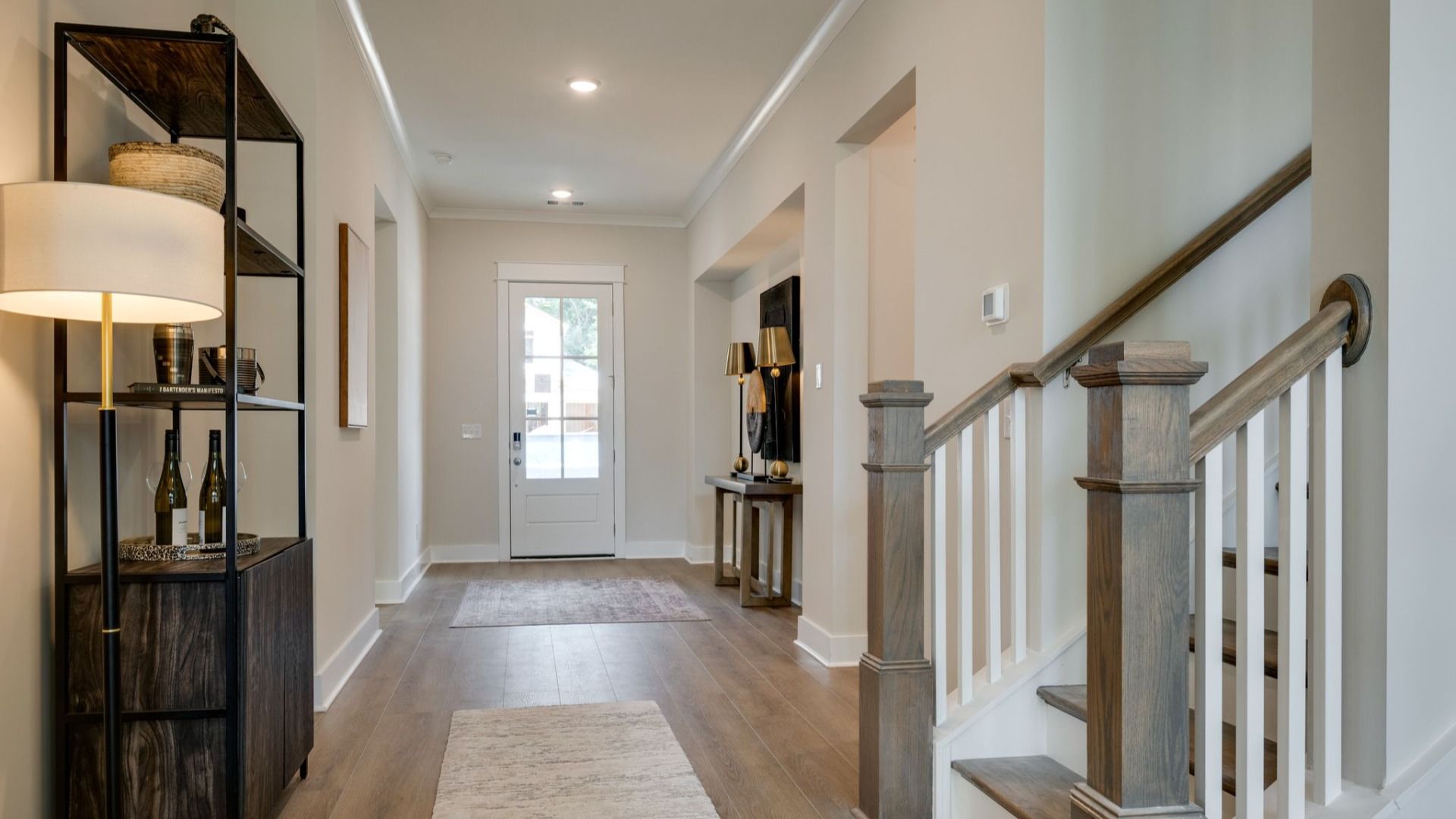Living area next to hallway and staircase