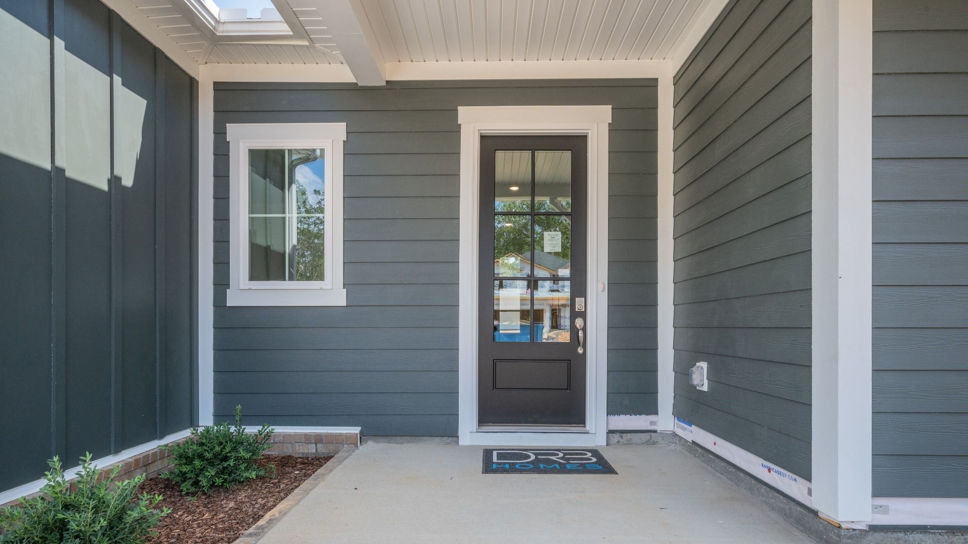 Front door entrance next to front porch