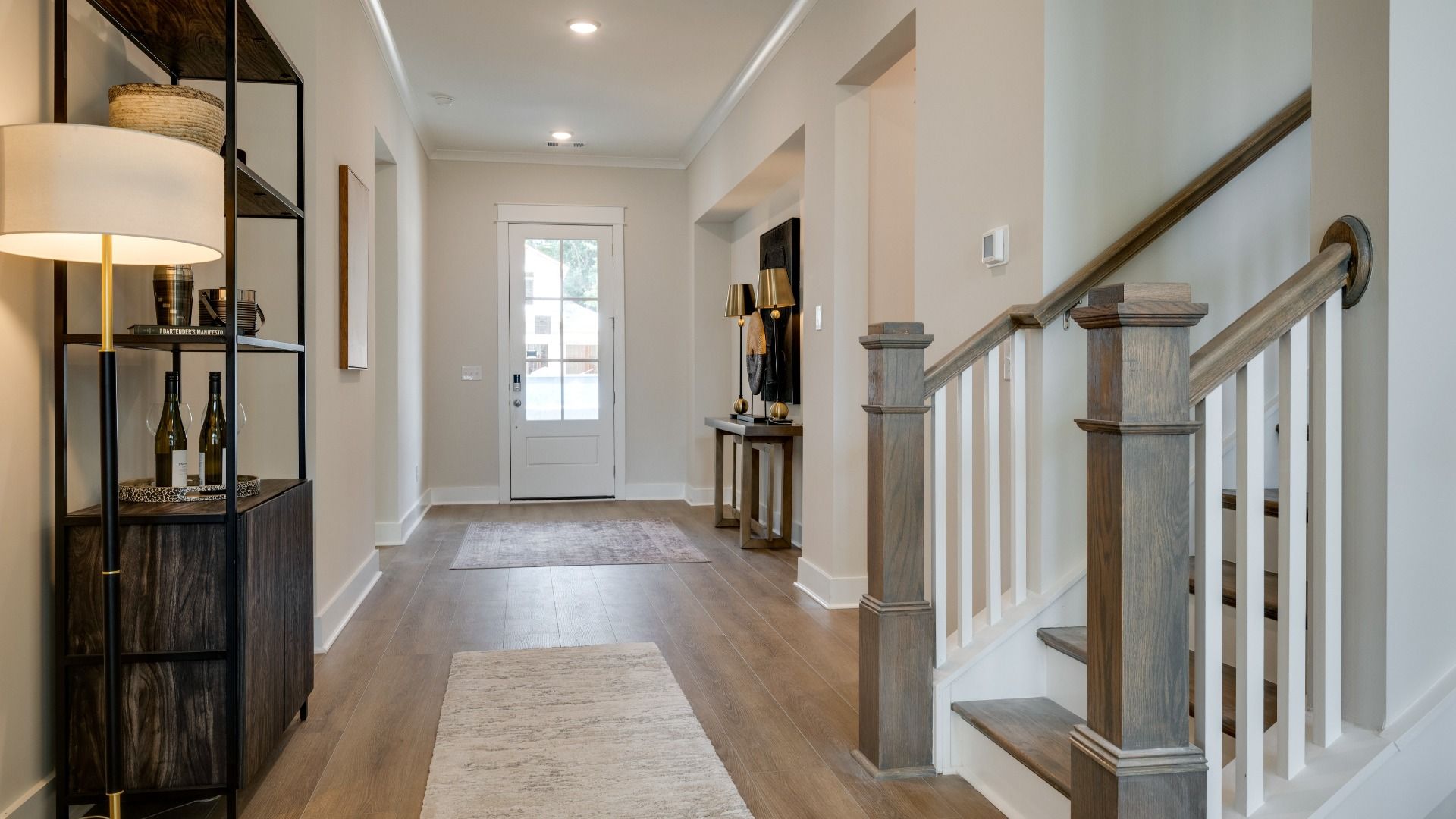 Living area next to hallway and staircase