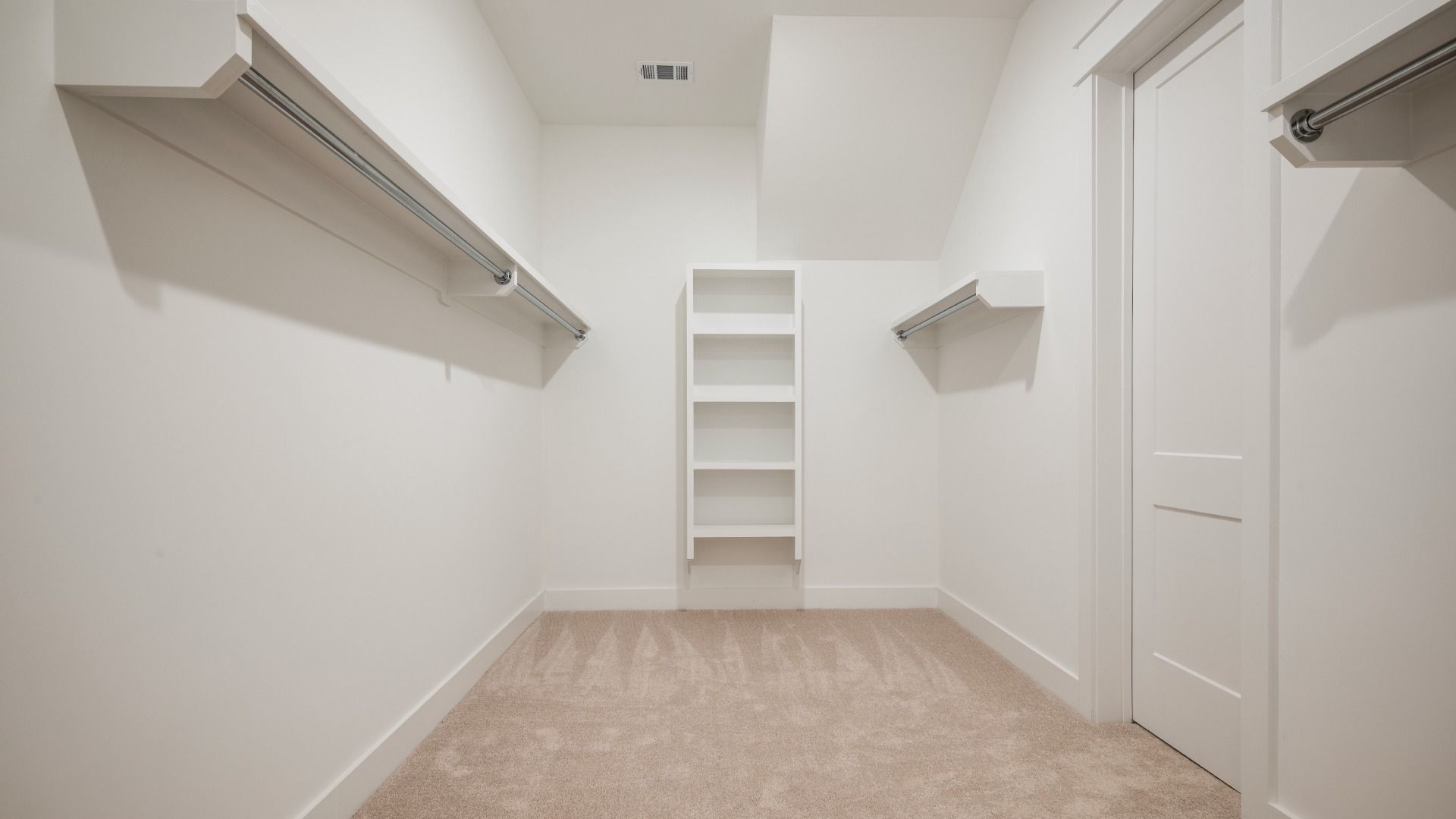 Large walk-in closet with various storage usages