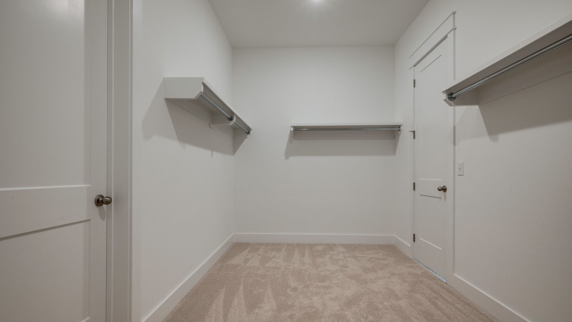 Large walk-in closet with various storage usages