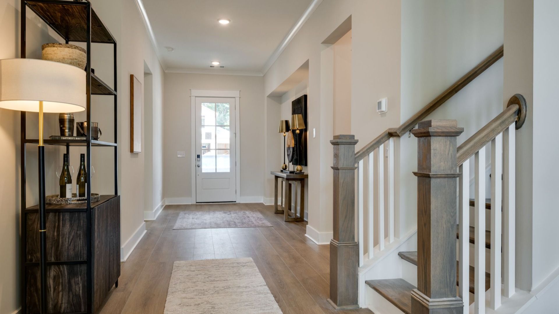 Living area next to hallway and staircase