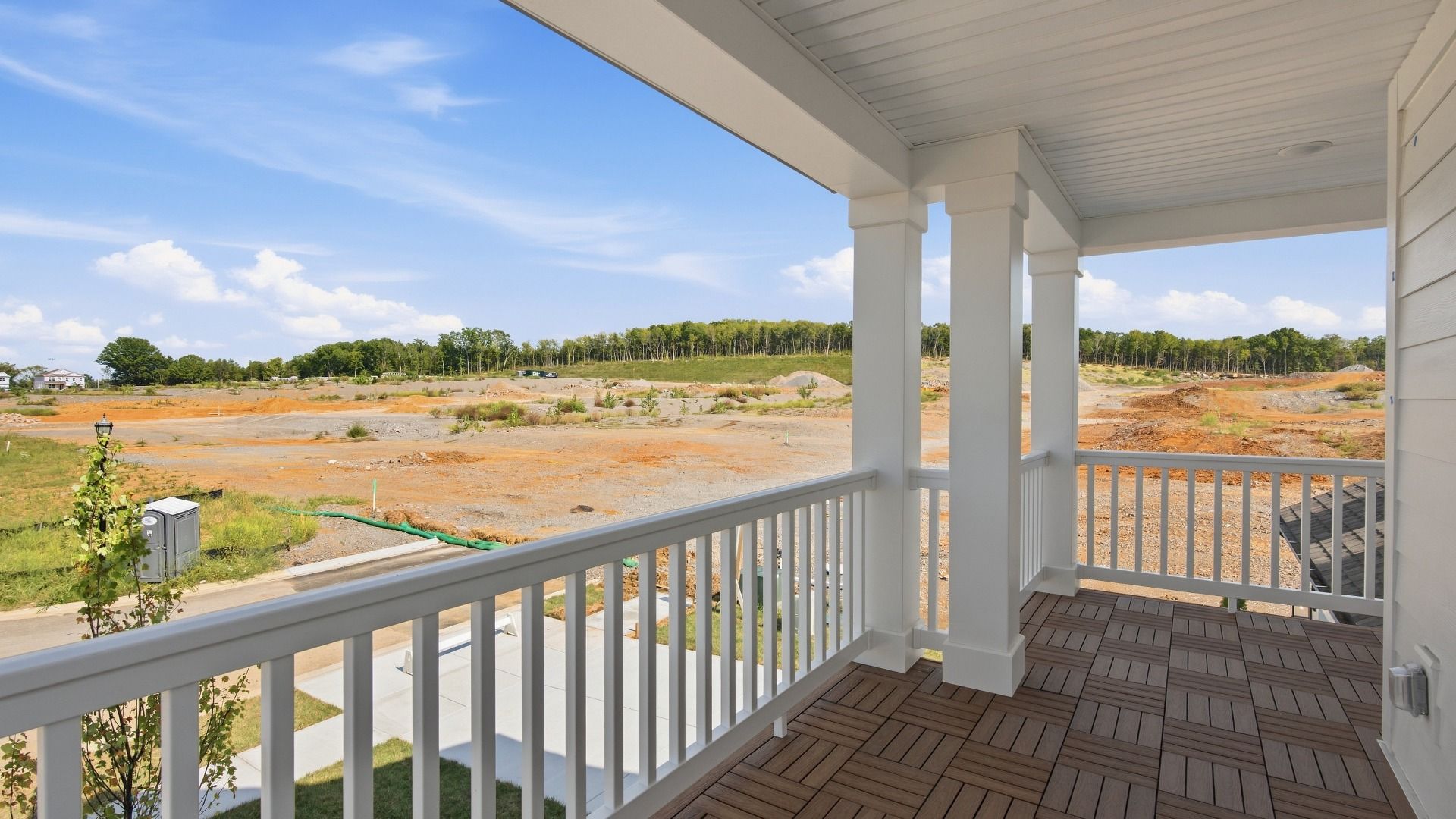Peaceful front balcony with space and views