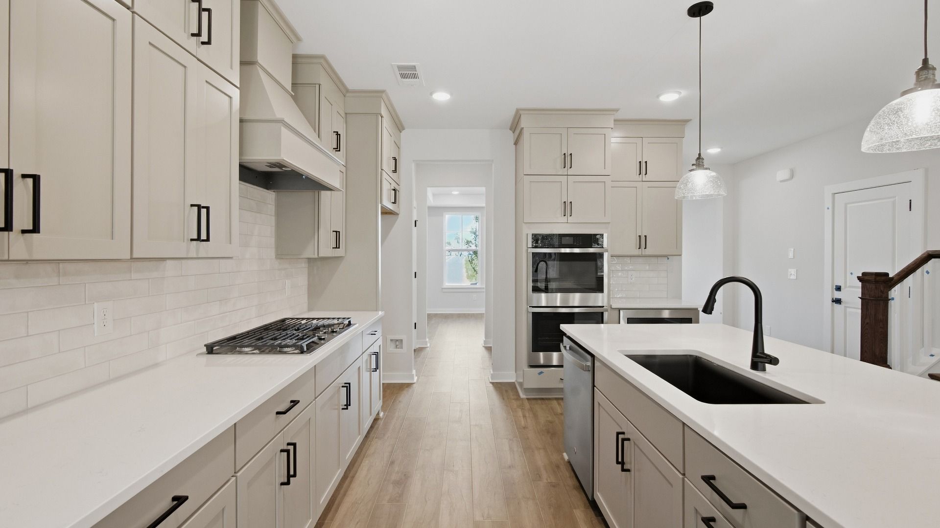 Kitchen featuring ceiling height cabinets, upgraded kitchen features, and optional butler's pantry included