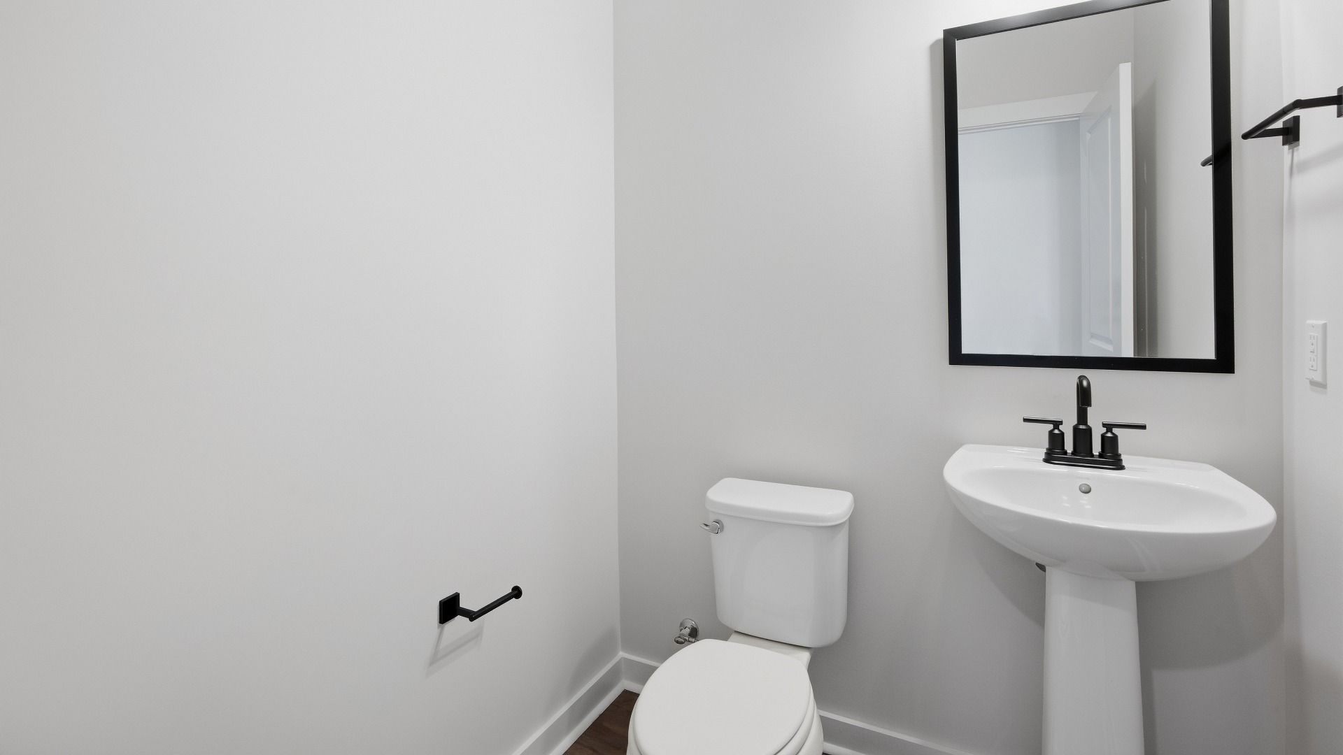 Secondary bathroom with sink and mirror