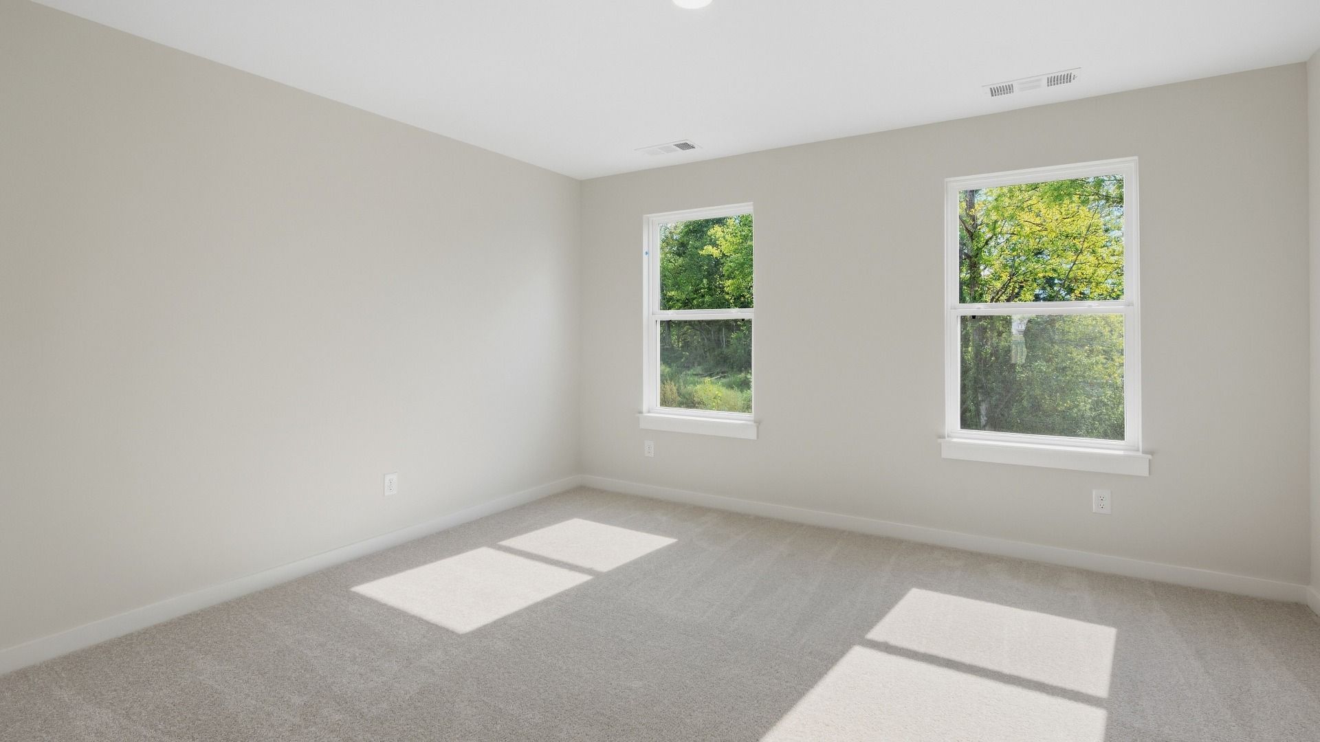 Upstairs secondary bedroom with connected bathroom and double-door closet