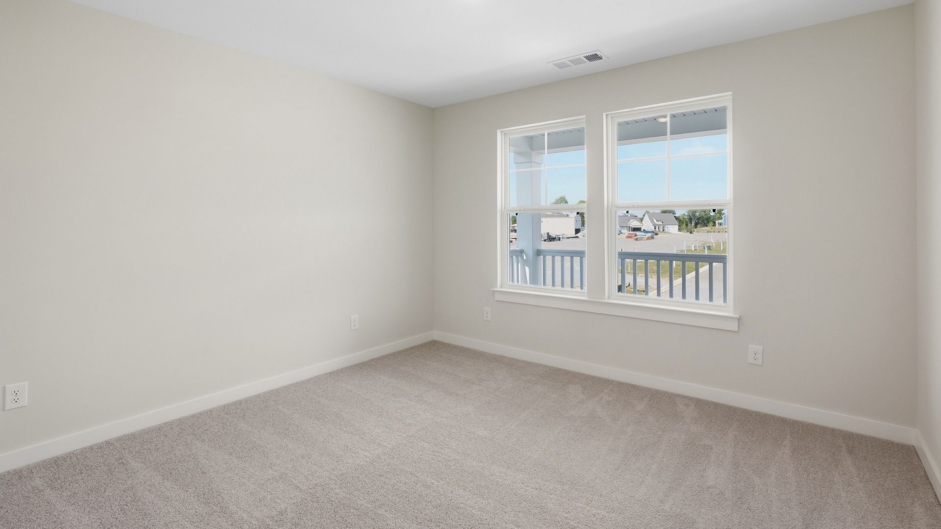 Secondary bedroom with porch view of community